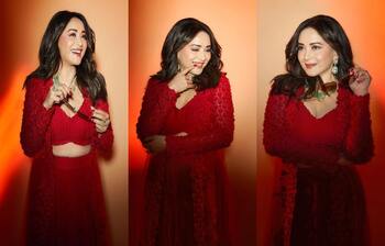 লাল পোশাকে অপরূপ মাধুরী