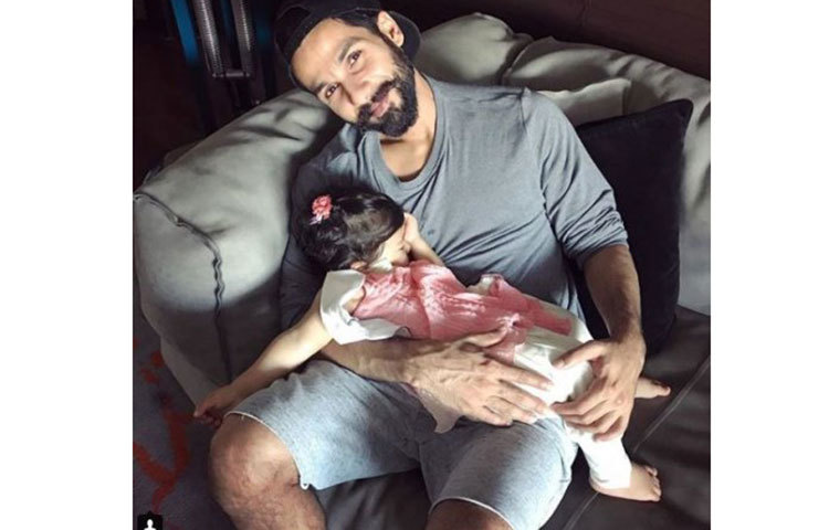 বাবার কোলে নিশ্চিন্তে ঘুমোচ্ছে মিশা।