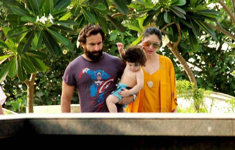 শীতল হওয়ার পর তৈমুর বাবার কোল থেকে নেমে খেলা করতে চাইছে।