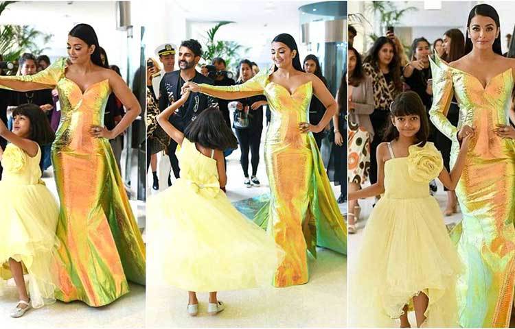 মায়ের সঙ্গে পাল্লা দিয়ে হালকা হলুদ রঙের পোশাকে নজর কাড়ল ঐশ্বর্য রায়ের ৭ বছরের মেয়ে আরাধ্যা। হোটেল মার্টিনেজ থেকে মায়ের সঙ্গেই কান-এর রেড কার্পেটে পৌঁছায় ছোট্ট আরাধ্যা।