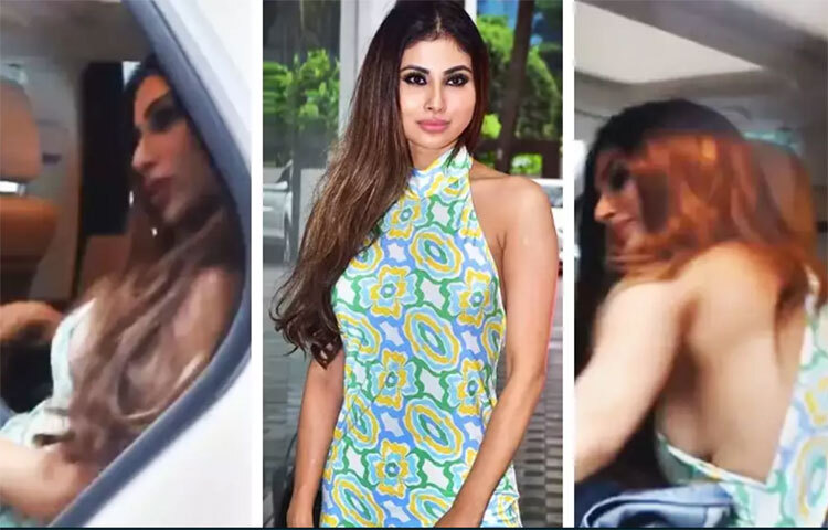 মৌনীকে একটি লং ড্রেস পরে গাড়ি থেকে নামতে দেখা যায়। মৌনীর কাছে ডেনিমের একটি জ্যাকেটও ছিল। ক্যামেরার সামনে আসবেন বলে গাড়ির ভিতরেই জ্যাকেটটি রেখে নামেন। ফোটো তোলার সময় মৌনী তার ড্রেস সামলাতে ব্যস্ত হয়ে পড়েন। ভিডিওটি দেখে অনেকেই বলেন, ‘এমন পোশাক পরারই বা কী দরকার, যা পরে তিনি স্বচ্ছন্দ বোধ করেন না।’ কেউ কেউ আবার জ্যাকেট পরার পরামর্শও দিয়েছেন। ছবি: সংগৃহীত