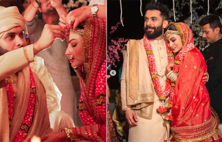 সব্যসাচীর লাল লেহেঙ্গায় বিয়ে সাজে দেখা গেছে মৌনি রায়কে। মাথায় বড় মাঙ্গটিকা, শরীরজুড়ে কুন্দনের জুয়েলারি, মাথায় লাল-সোনালি ওড়না। সেই ওড়নাতেও বাংলা নয়, সংস্কৃতে লেখা রয়েছে ‘আয়ুষ্মতী ভব:’। ছবি: সংগৃহীত