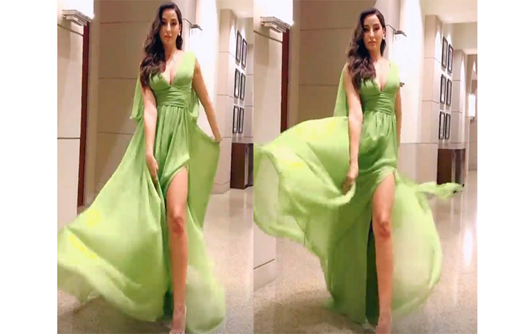 সবুজ রঙের স্প্লিট ড্রেসে সোশ্যাল মিডিয়ায় ঝড় তুলেছেন নোরা। ছবি: সংগৃহীত