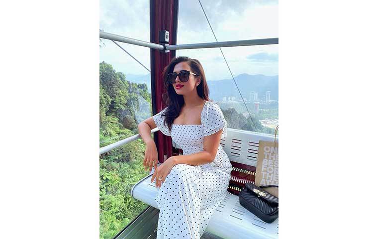 কালো চশমায় নুসরাত।