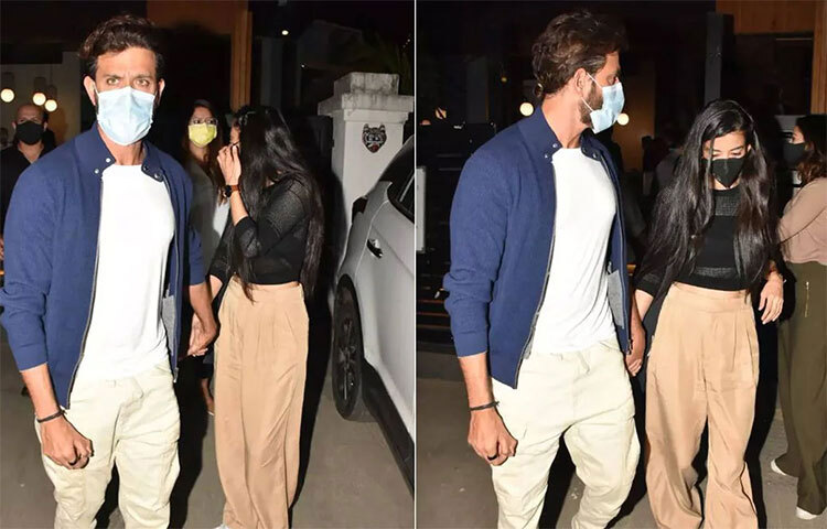 দুজনের মুখেই ছিল মাস্ক। তাই মাস্ক ঢাকা মুখের ‘রহস্যময়ী’র পরিচয় প্রথমে জানা যায়নি। কিন্তু নেটদুনিয়ায় চাপা থাকে না কিছুই। মাস্ক ঢাকা মুখের মানবীর আসল পরিচয় প্রকাশ্যে আসতে বেশি সময় লাগেনি। ছবি: সংগৃহীত