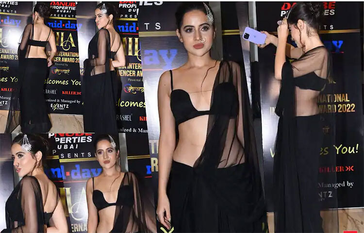 উরফি জাভেদ একটি কালো শাড়ির সঙ্গে একটি সুপারহিট ব্র্যালেট ব্লাউজ পরেছিলেন। চুলে খোঁপা, ভারী মেক-আপ, এবং সিলভার হাই হিলে উরফি এদিন তার লুকে দিয়েছিলেন অন্যরকম ছোঁয়া। ছবি: সংগৃহীত