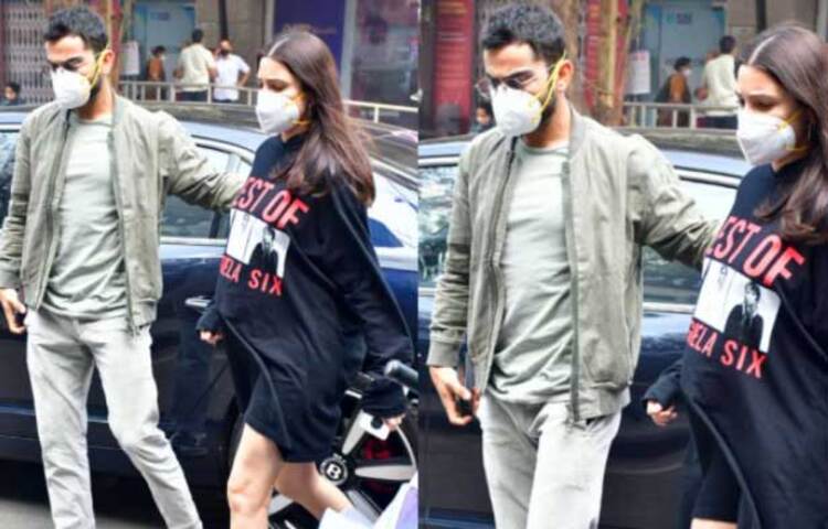 কালো রঙের পোশাক পরে, মুখে মাস্ক লাগিয়ে ক্লিনিকে হাজির হন আনুশকা শর্মা। স্ত্রীকে আগলে রেখে ধীরে ধীরে ক্লিনিকে চলে যান বিরাট। ছবি: সংগৃহীত