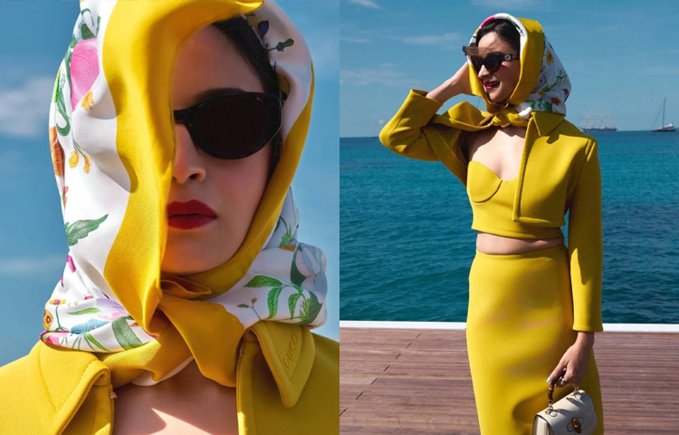 কোরসেট টপের ওপর লেয়ার করা ক্রপড ব্লেজার আর তার সঙ্গে পেনসিল স্কার্ট-সব মিলিয়ে এক নিখুঁত ভিনটেজ লুক, যা একঝলকেই ছড়িয়ে দেয় রাজকীয় দ্যুতি। তার ভিনটেজ লুকে অনন্য মাত্রা যোগ করেছে মাথায় পরা গুচির ফ্লোরাল স্কার্ফ, যা একদিকে নস্টালজিক, অন্যদিকে অনবদ্য ফ্যাশন স্টেটমেন্ট।