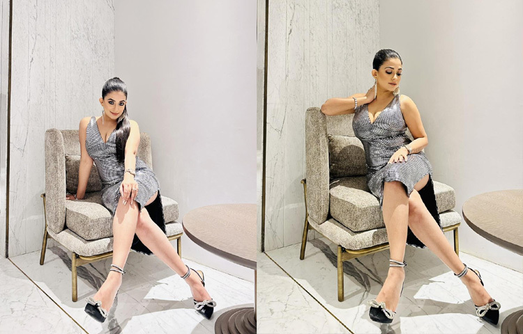 ডইপ ভি নেকের রূপালি সিকুইনের মিনিড্রেসে আবেদনময়ী মন্দিরা।