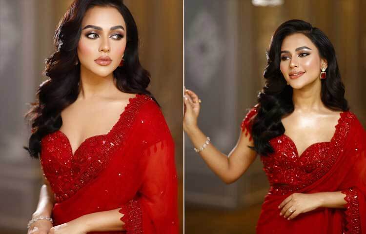 টকটকে লাল শাড়িতে নজরকাড়া অভিনেত্রী নুসরাত ফারিয়া।