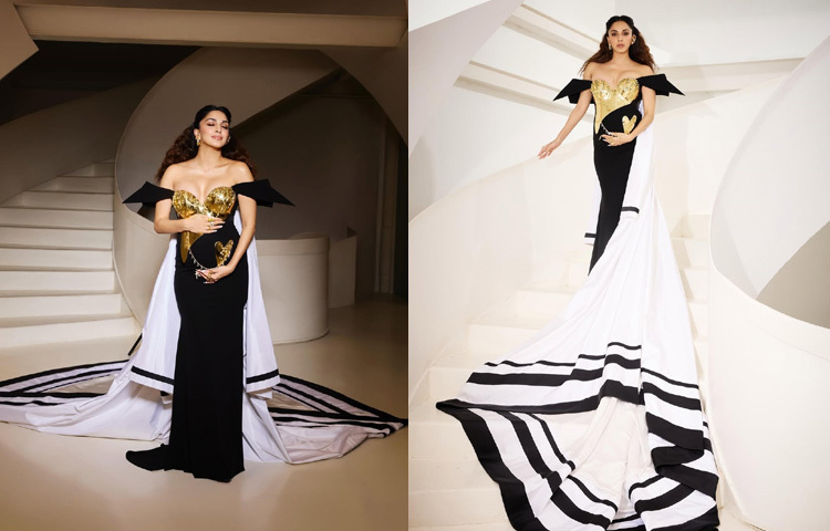 কিয়ারার পরনে ছিল সফট গোল্ড ও পার্ল হোয়াইটের এক ফ্লুইড গাউন। কোমল কাপড়ে বেবি বাম্পটি যেন ছিল ক্যানভাসের কেন্দ্রবিন্দু, আর সেটিকে ঘিরেই ফুটে উঠেছিল ডিজাইনারের শিল্পকর্ম।