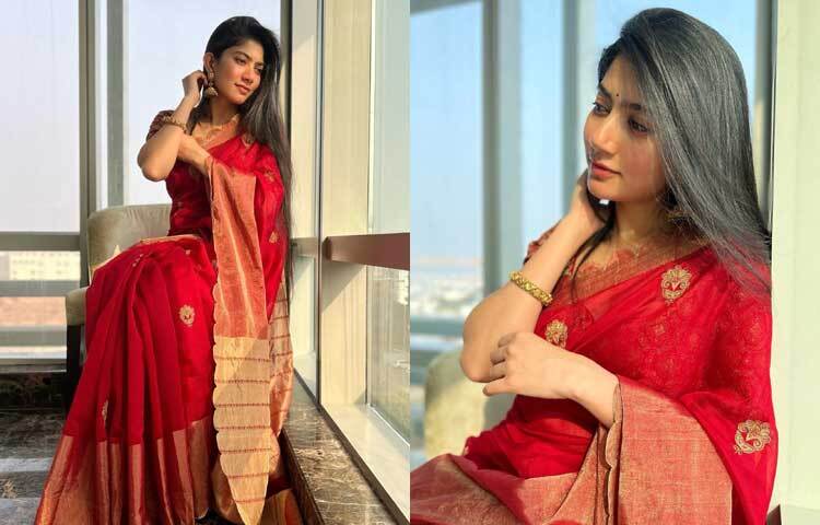 লাল শাড়ি সাথে কপালের ছোট্ট লাল টিপে অপরূপ লাগছে তাকে।