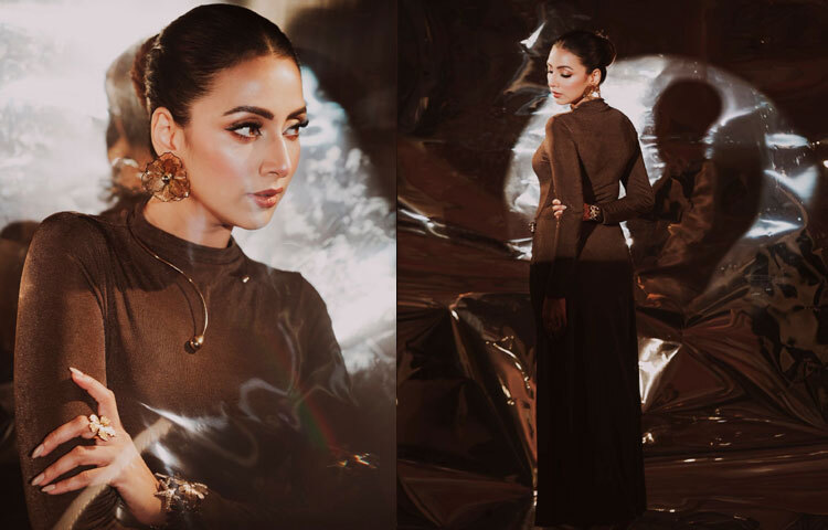 মিনিমাল কাটের এই সিলুয়েট ড্রেস শীতের দিনে গ্ল্যাম লুক তৈরিতে যথেষ্ট। ঠান্ডা আমেজে বডি-হাগিং আউটফিট যেমন উষ্ণতা দেয়, তেমনি অ্যাকসেসরিজের গোল্ড টোন পুরো সাজে যোগ করে নিয়ন্ত্রিত ঝলক।