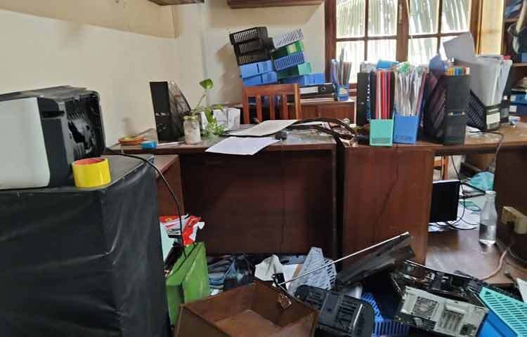 Signs of vandalism remain in various rooms.