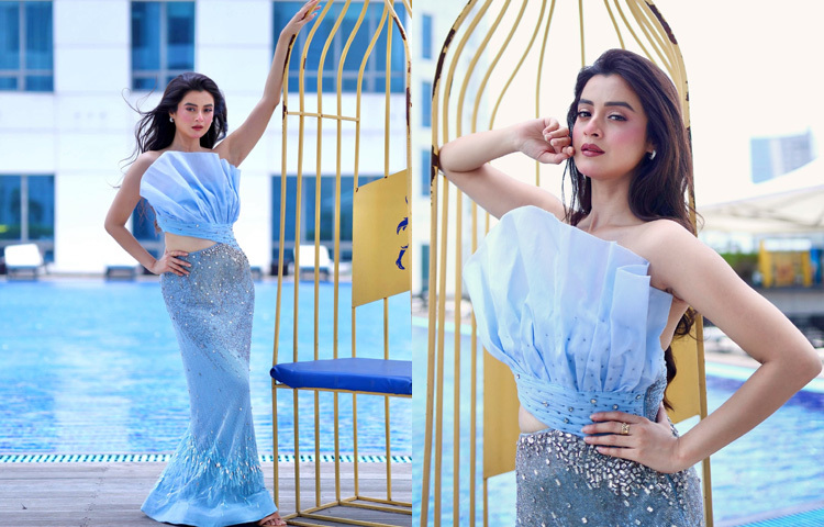 স্ট্রাকচারড বডিসের পাউডার ব্লু সিকুইনের কাট আউট গাউনে বেশ আবেদনময়ী লাগছে অভিনেত্রীকে।