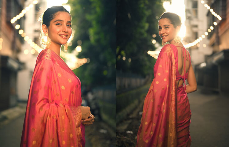 বেনারসি শাড়ির সঙ্গে ব্যাকলেস ব্লাউজ, কানে স্টেটমেন্ট দুল, আর খোঁপায় গাঁজরার মালা-দেবচন্দ্রিমাকে দেখে যেন চোখ ফেরানো যায় না।