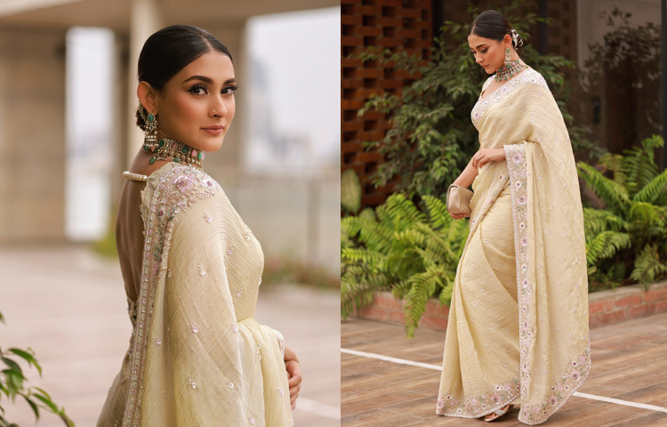 অভিনেত্রী মেহজাবীন চৌধুরীর ক্রিম রঙের ক্রেপ জর্জেটের আরামদায়ক শাড়ির সঙ্গে জুটি হয়েছে মুক্তার মালা দেওয়া ব্যাকলেস ডিজাইনের স্লিভলেস ব্লাউজ। চোখে আইলাইনার আর মাশকারা দেওয়া, সুসজ্জিত ভ্রু যুগল, ঠোঁটে ন্যুড লিপস্টিক, গালে হালকা গোলাপি ব্লাশ অন, হীরার নাকফুল নাকে আর কপালে ছোট্ট পাথরের টিপে অপরূপ লাগছে তাকে।