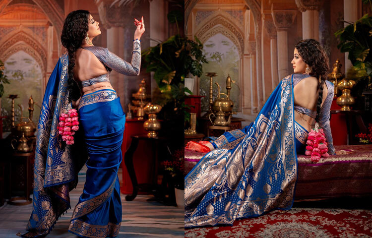 ফুলস্লিভ ও ব্যাকলেস ব্লাউজের সঙ্গে নীল শাড়িতে অপরূপ লাগছে তাকে।