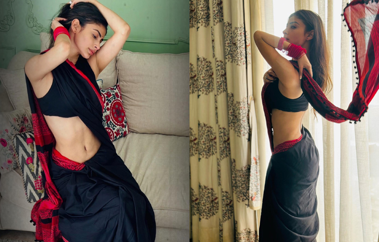 লাল পাড়ের কালো শাড়িতেই লাস্যময়ী হয়ে ক্যামেরার সামনে পোজ দিয়েছেন মৌনি রায়। ছবি: ফেসবুক