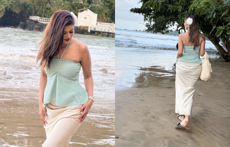 সঙ্গে অফ হোয়াইট লং স্কার্ট, যা প্রতিটি ভঙ্গিমায় ছড়িয়ে দিয়েছে প্রশান্ত দ্বীপীয় আবহ।