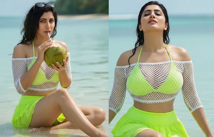 নায়লার পরনে ছিল উজ্জ্বল নিয়ন সবুজ স্কার্ট ও একই শেডের ব্রালেট টপ, যার ওপর পরা সাদা জাল-নকশার ক্রপ টপ। এই পোশাকচয়ন একদিকে যেমন ট্রেন্ডি, তেমনি গ্রীষ্মের গরমে আরামদায়কও।