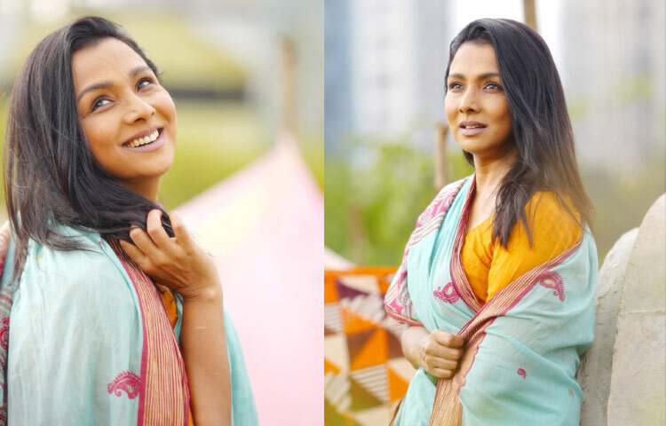 কখনো আবার মেরুন কলকা নকশার মিন্টরঙা শাড়িতে পাইপের ধারে বসে থাকা এক জীবনের প্রতীক হয়ে উঠেছেন তিনি।