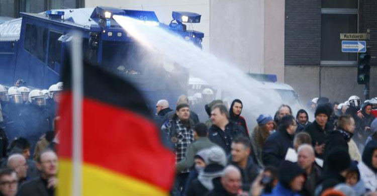 Anti-migrant protest turns violent as German welcome cools