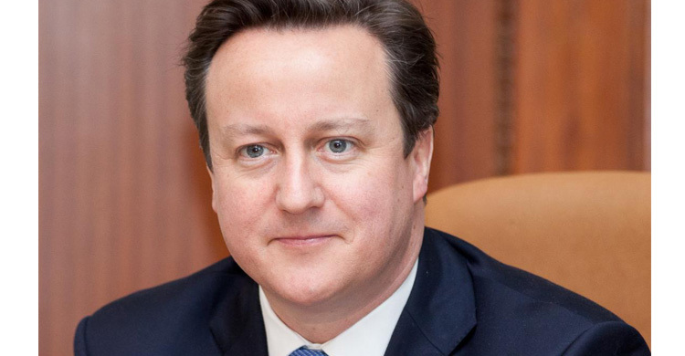 Cameron hums merry tune after announcing quit