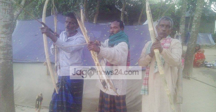 জানমাল রক্ষায় সাঁওতালদের সম্বল শুধু তীর-ধনুক