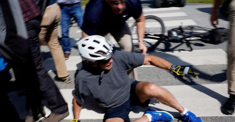 Biden falls after flubbing bike dismount, but uninjured