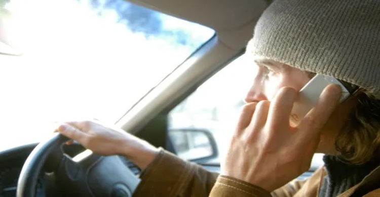 UK bans any use of mobile phones while driving
