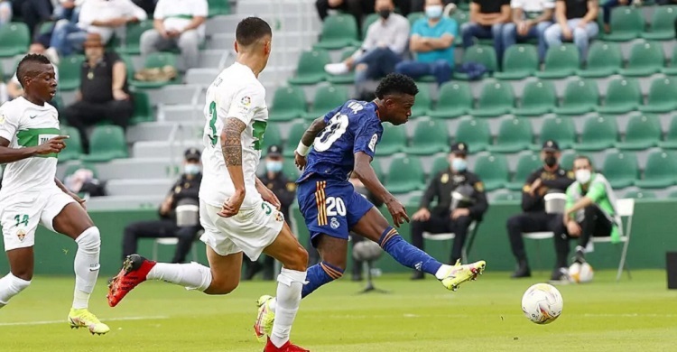 Vinicius double sends Read Madrid top