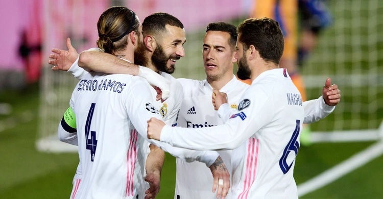 Real ease into Champions League last eight