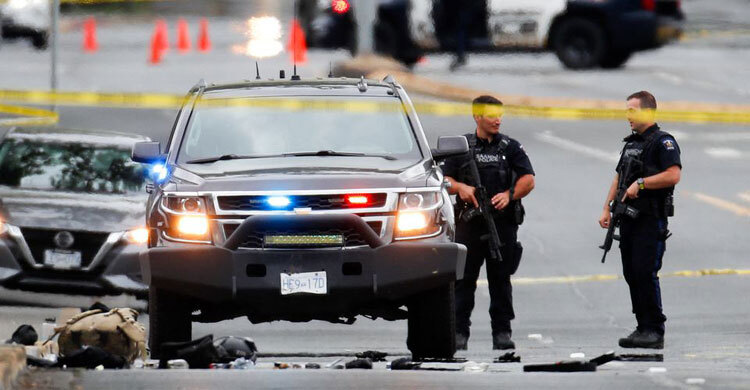2 gunmen killed, six officers wounded in shootout at Canadian bank