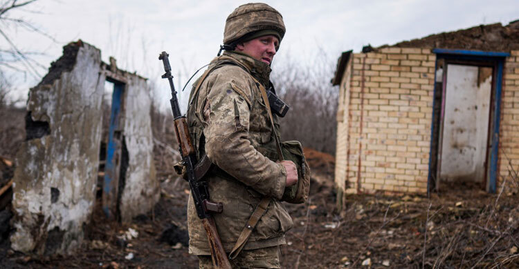 Ukraine imposes state of emergency, summons citizens home