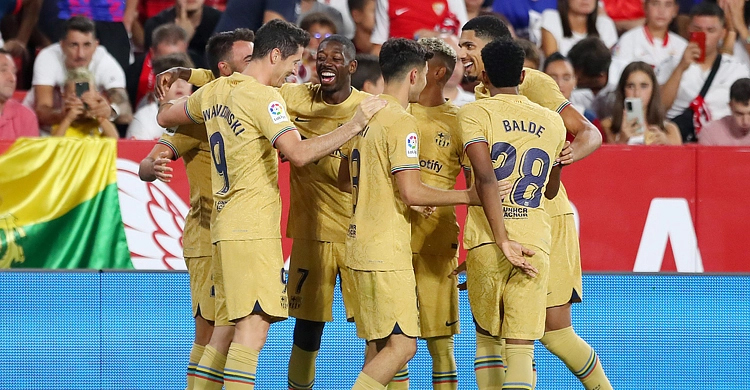 Barca maintain unbeaten start with win at Sevilla