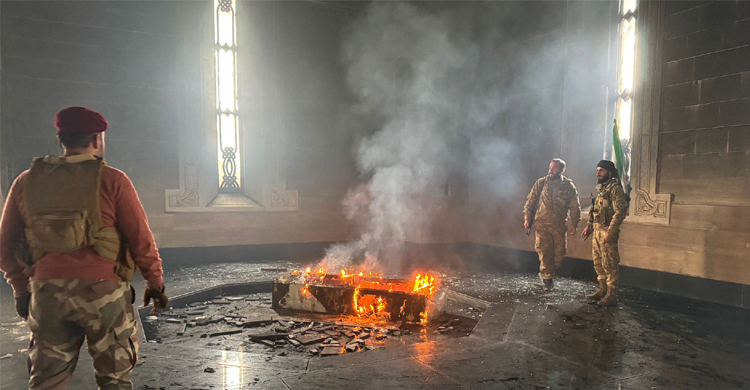 Syrian rebels put tomb of Assad's father on fire