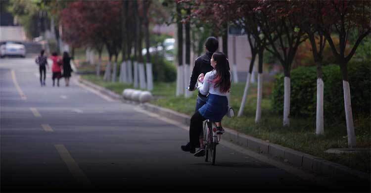 Enjoy the flowers, fall in love: Chinese univ push for romance in an age of decline