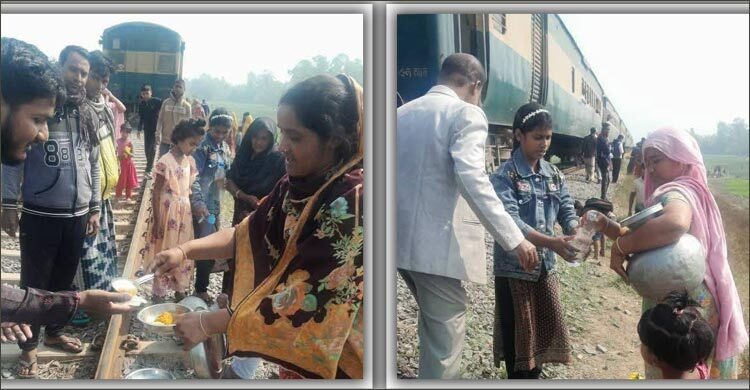 বিকল ট্রেনের যাত্রীদের খাবার খাইয়ে প্রশংসায় ভাসছেন পাবনাবাসী