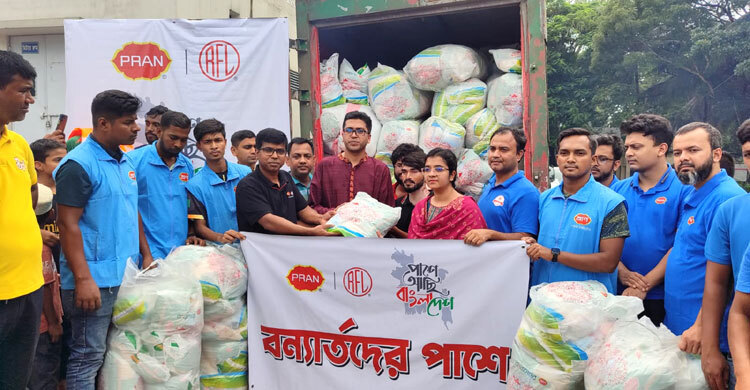 PRAN-RFL stands beside flood-hit people