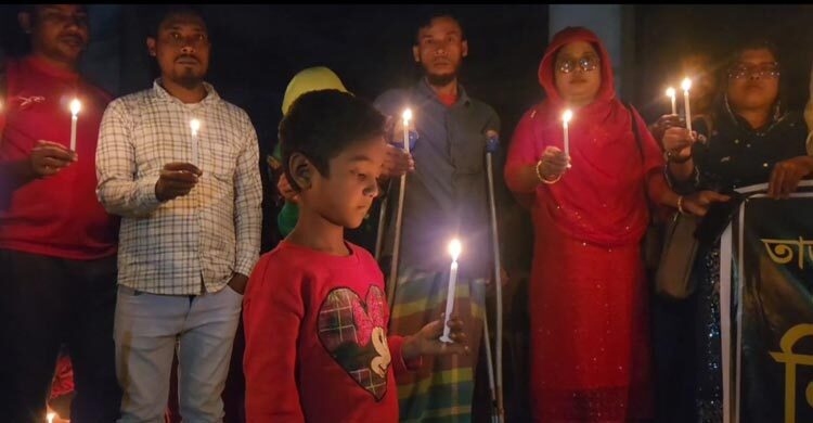 মোম জ্বেলে তাজরীন ফ্যাশনের অগ্নিকাণ্ডে নিহত শ্রমিকদের স্মরণ