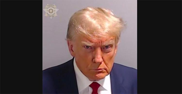 Trump arrested in election case, mug shot released
