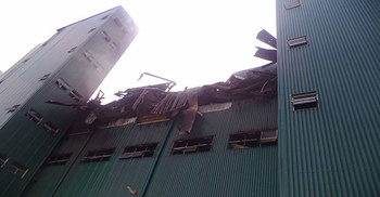 Fire doused leaving textile mill collapsed