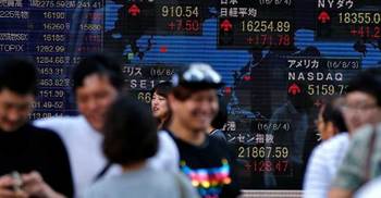 Asian stocks gain after UK rate cut ahead of US jobs report 