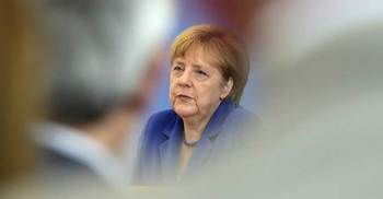 Angela Merkel stands by refugee policy after attacks