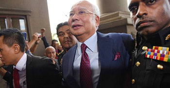 Malaysia’s ex-PM Najib charged with corruption