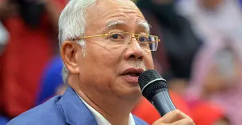 Corruption scandal: Malaysian police raid home of ex-PM