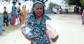 Jago News and PRAN-RFL stand beside flood hit people
