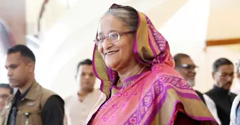 PM returns home from London
