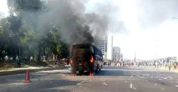 RMG workers continue agitation, set fire on bus